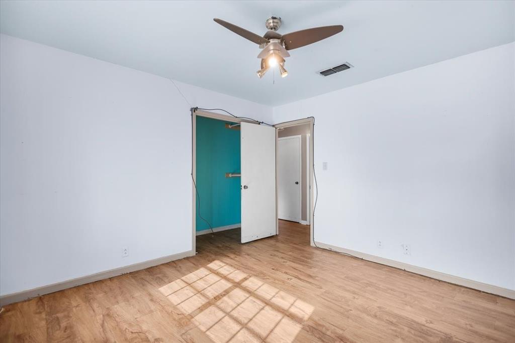 511 Happy Mount Mount Pleasant, TX 75455 - Photo 19 of 37 wooden floor in an empty room