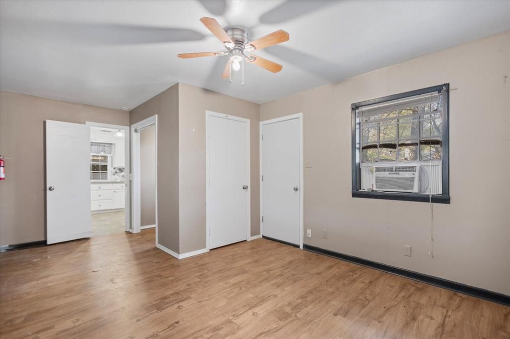 511 Happy Mount Mount Pleasant, TX 75455 - Photo 28 of 37 a view of an empty room with window and wooden floor