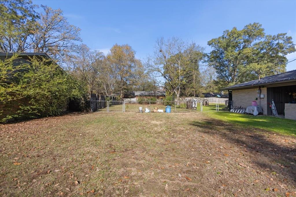 511 Happy Mount Mount Pleasant, TX 75455 - Photo 30 of 37 a view of a yard with a house