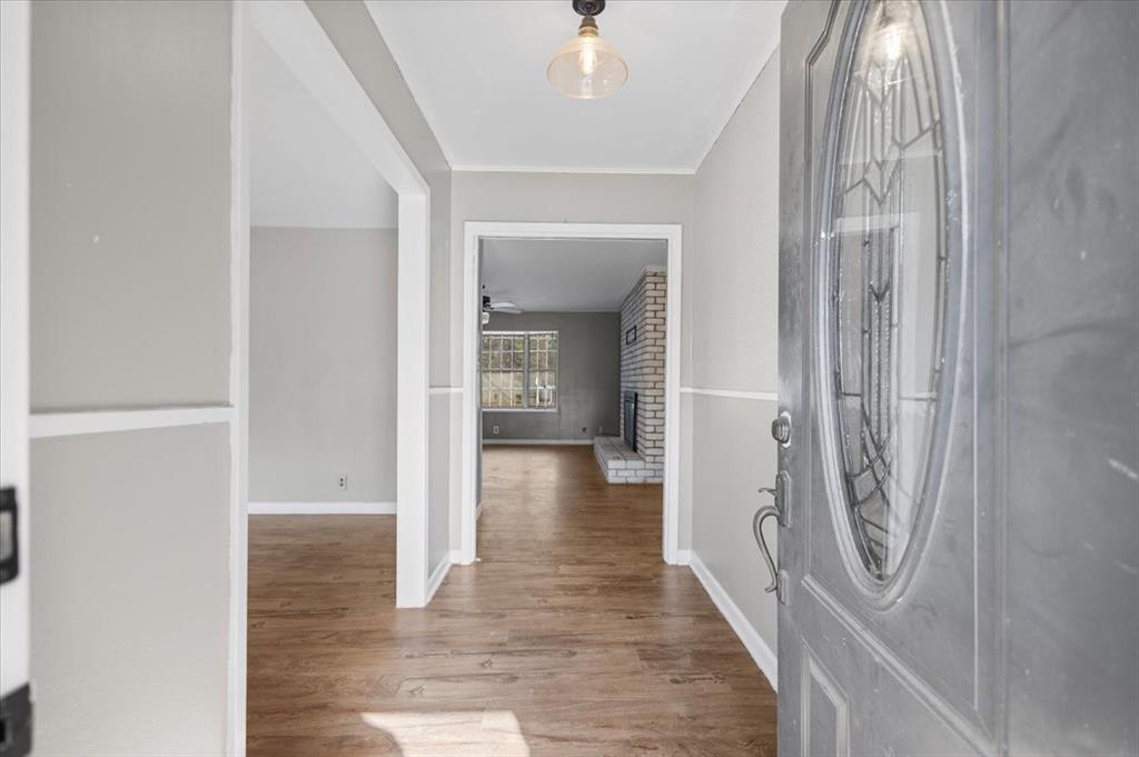 511 Happy Mount Mount Pleasant, TX 75455 - Photo 3 of 37 a view of a hallway with wooden floor and staircase