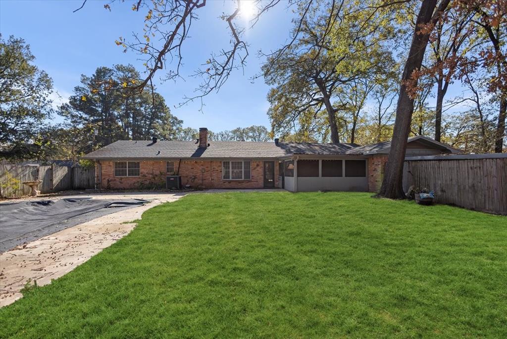 511 Happy Mount Mount Pleasant, TX 75455 - Photo 32 of 37 a front view of a house with a yard