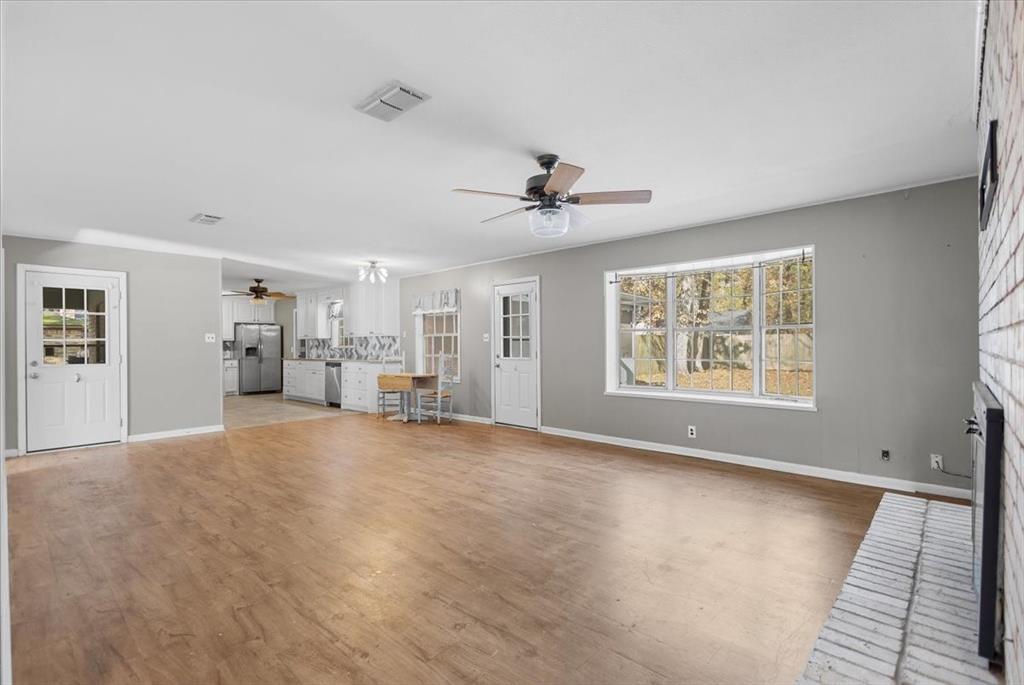 511 Happy Mount Mount Pleasant, TX 75455 - Photo 9 of 37 a view of empty room with wooden floor and window