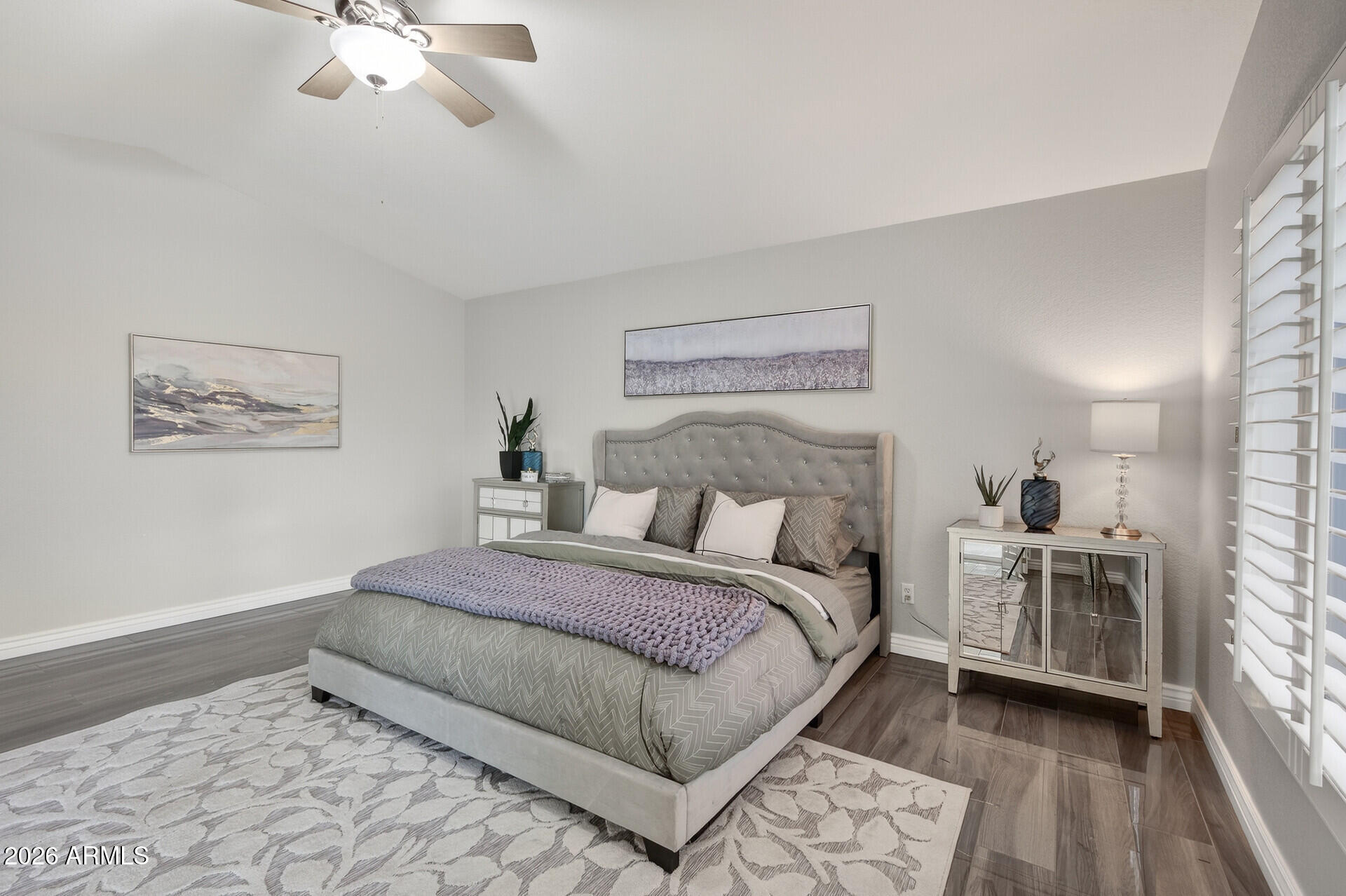 3533 North 159th Lane Goodyear, AZ 85395 - Photo 27 of 65 a bedroom with a bed and a chandelier