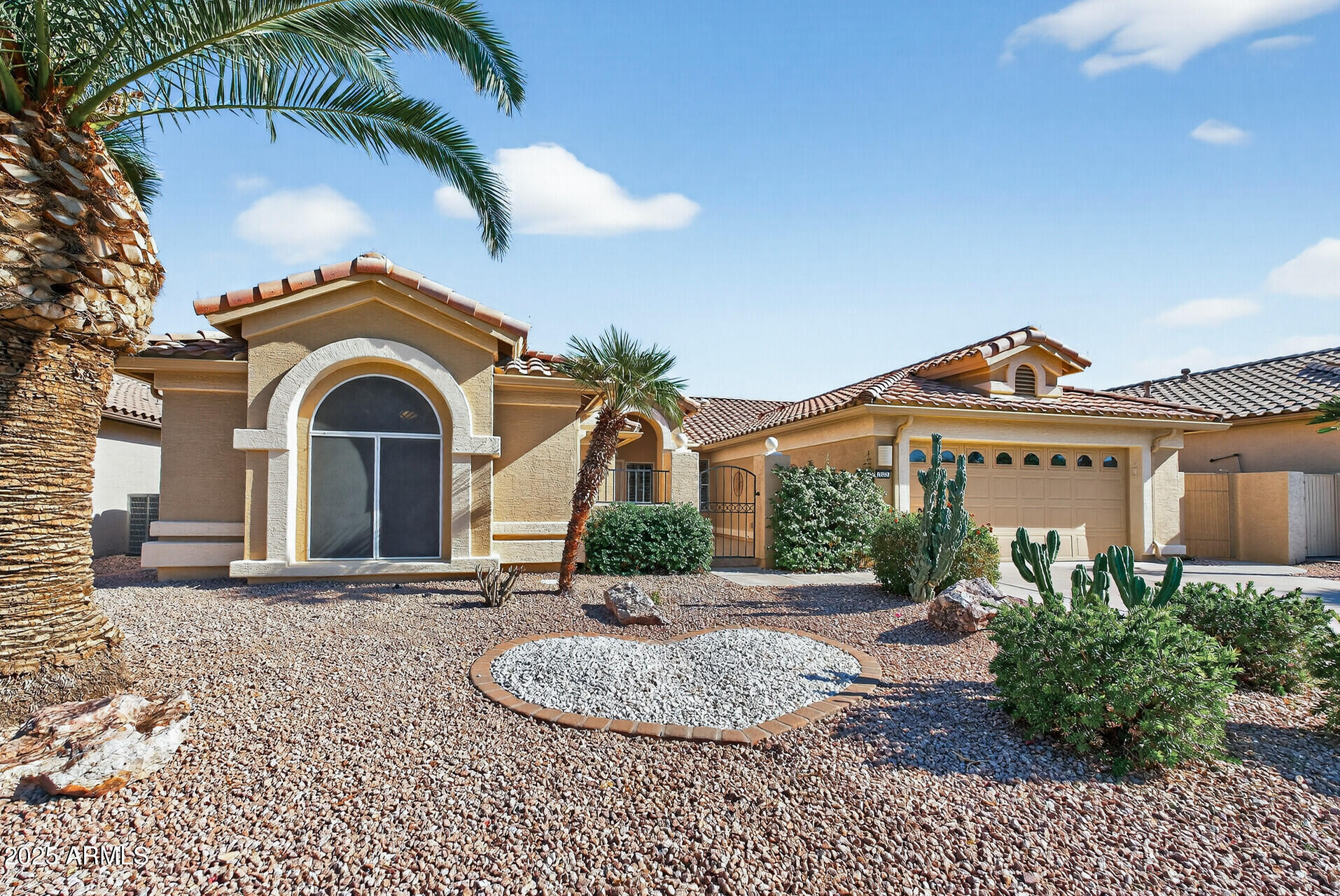 3533 North 159th Lane Goodyear, AZ 85395 - Photo 3 of 65 a front view of a house with a yard