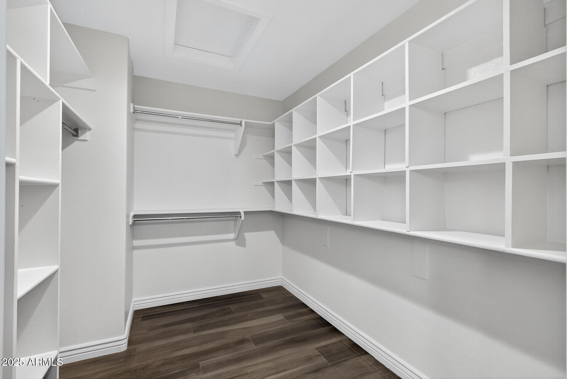3533 North 159th Lane Goodyear, AZ 85395 - Photo 32 of 65 a view of walk in closet with empty racks