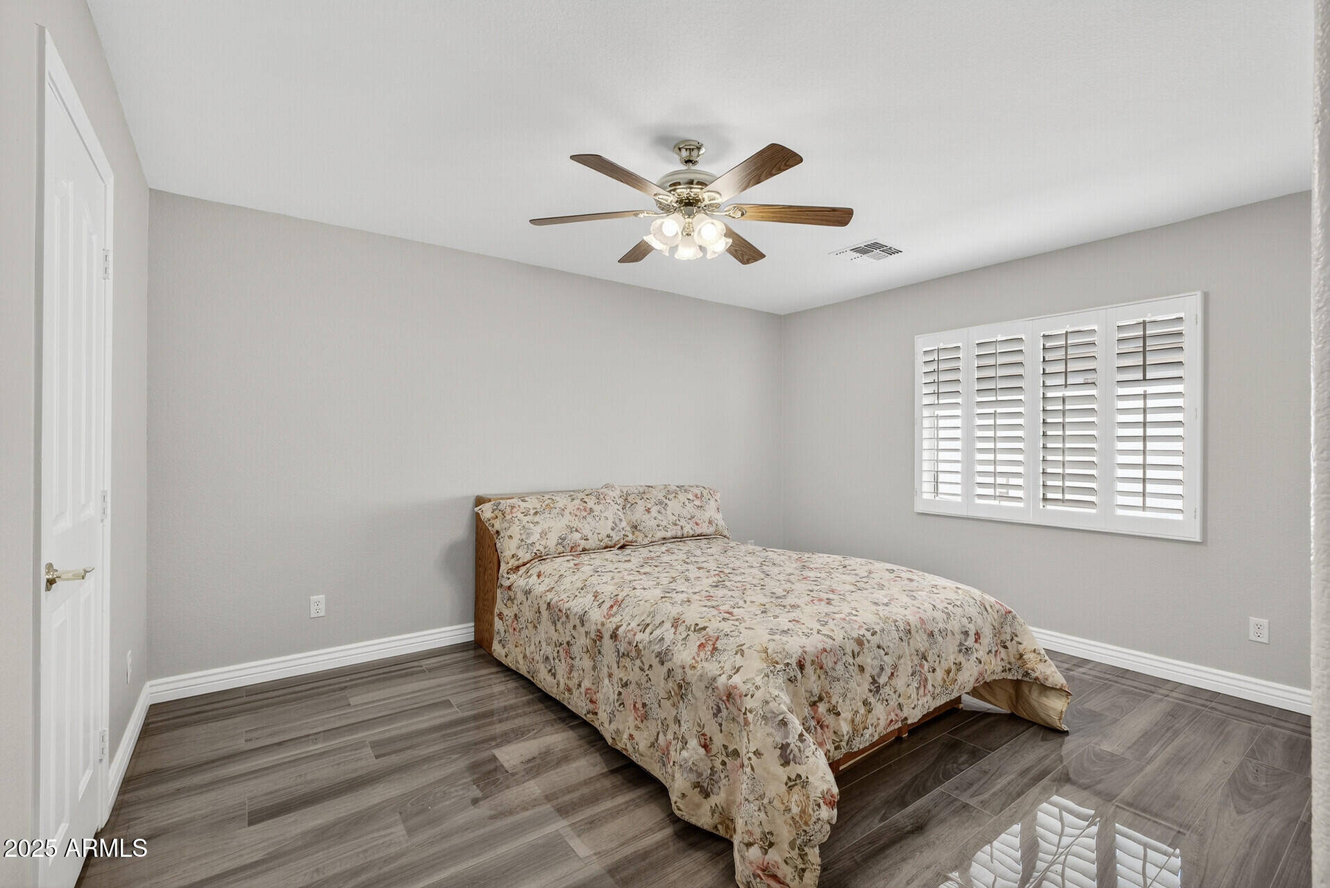 3533 North 159th Lane Goodyear, AZ 85395 - Photo 33 of 65 a bedroom with a bed and a window