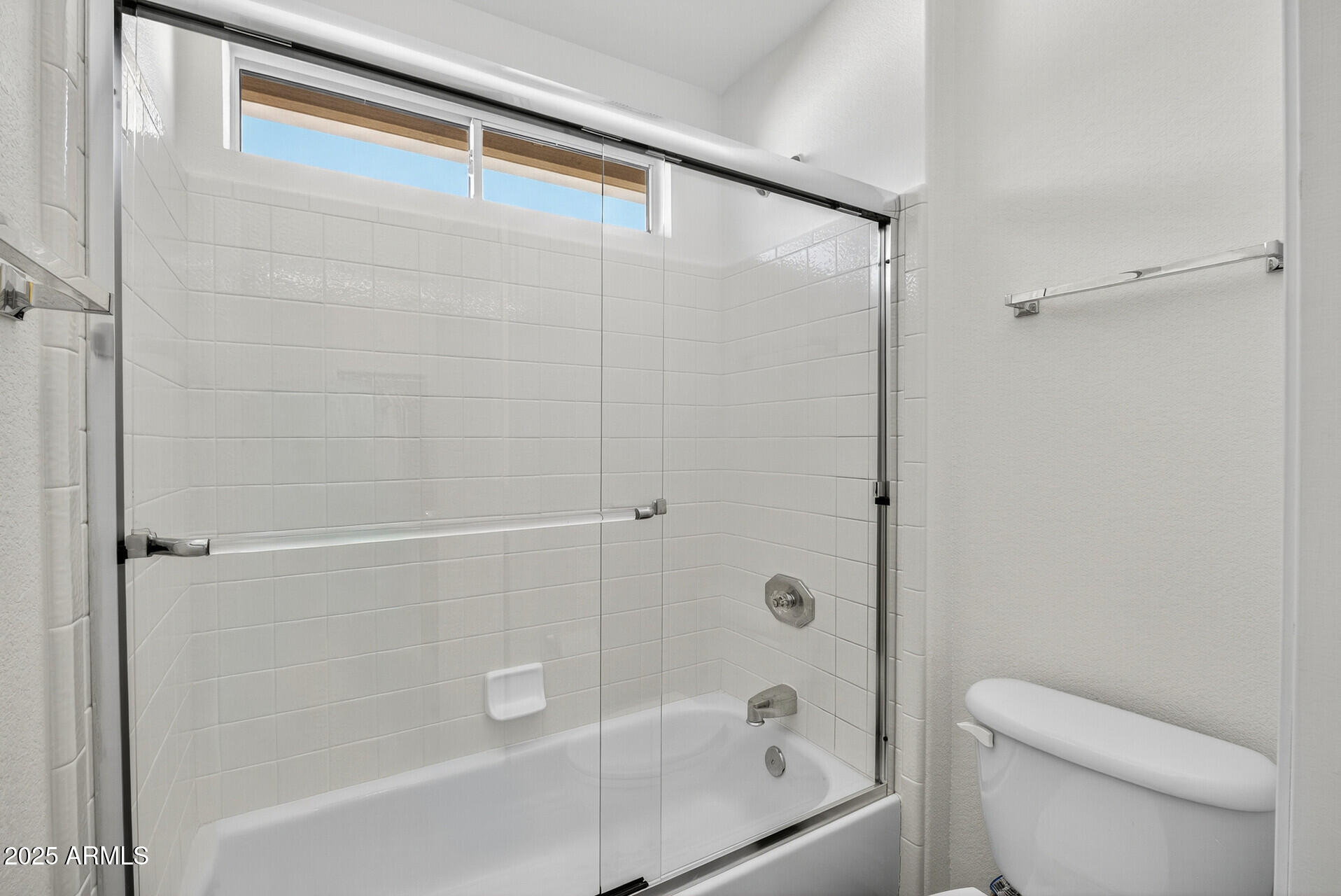 3533 North 159th Lane Goodyear, AZ 85395 - Photo 41 of 65 a bathroom with a bathtub and a toilet