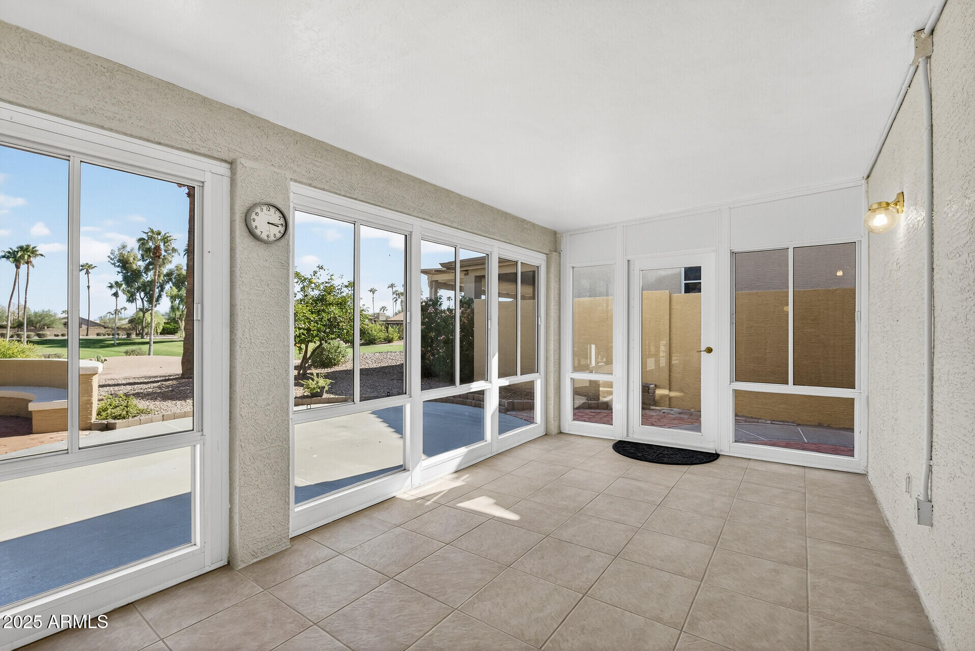 3533 North 159th Lane Goodyear, AZ 85395 - Photo 44 of 65 a view of a big room with sliding door and balcony