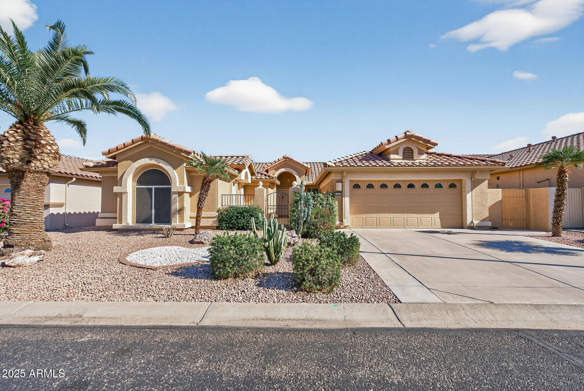 3533 North 159th Lane Goodyear, AZ 85395 - Photo 5 of 65 a front view of a house with a garden