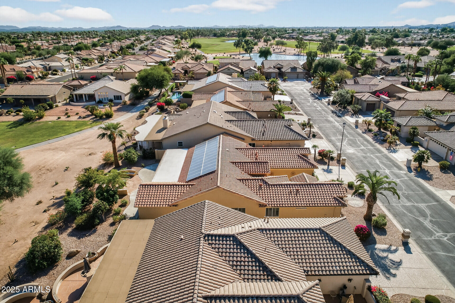 3533 North 159th Lane Goodyear, AZ 85395 - Photo 56 of 65 an aerial view of a residential apartment building with a yard