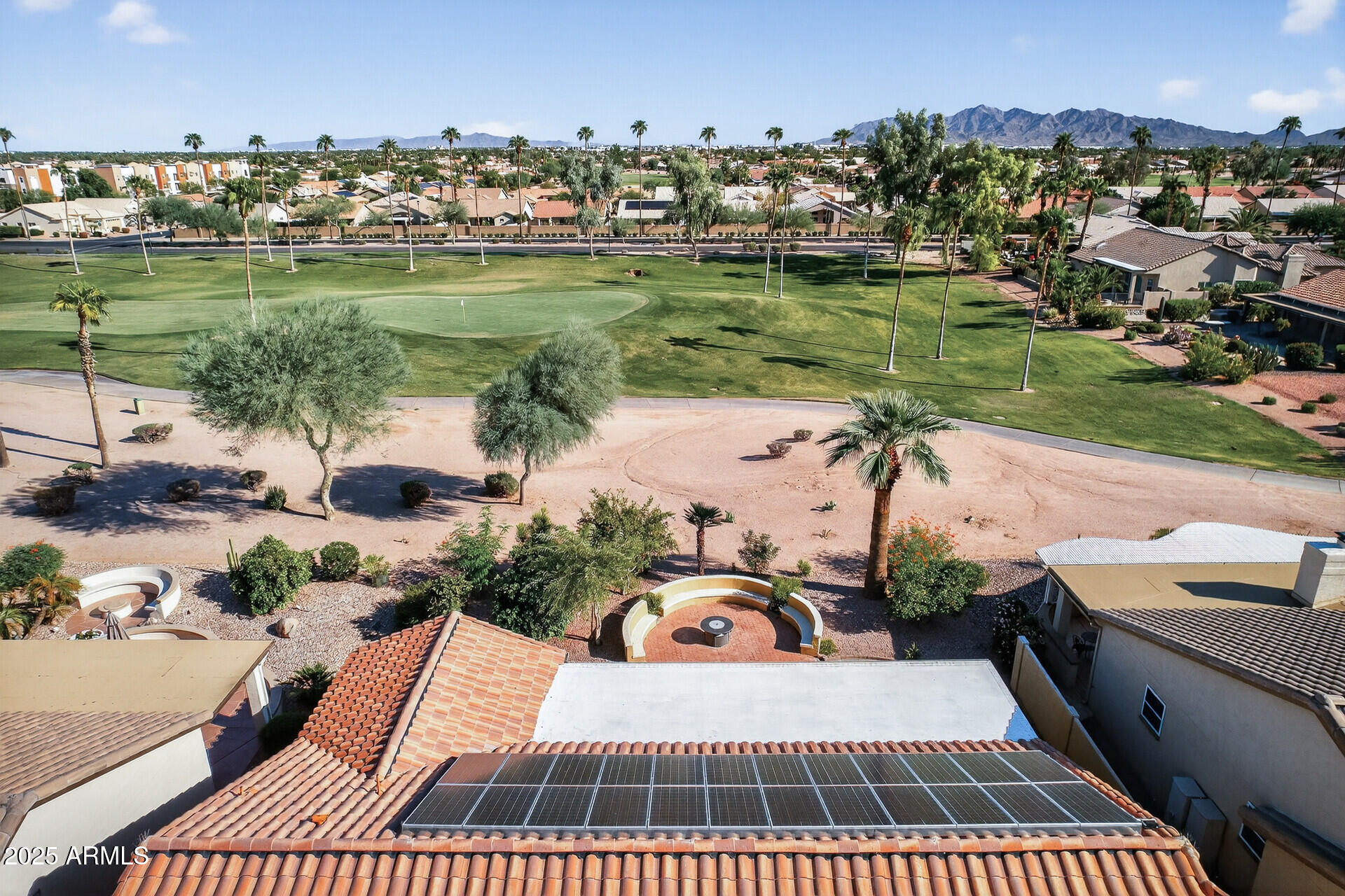 3533 North 159th Lane Goodyear, AZ 85395 - Photo 60 of 65 an aerial view of a house with a garden and lake view
