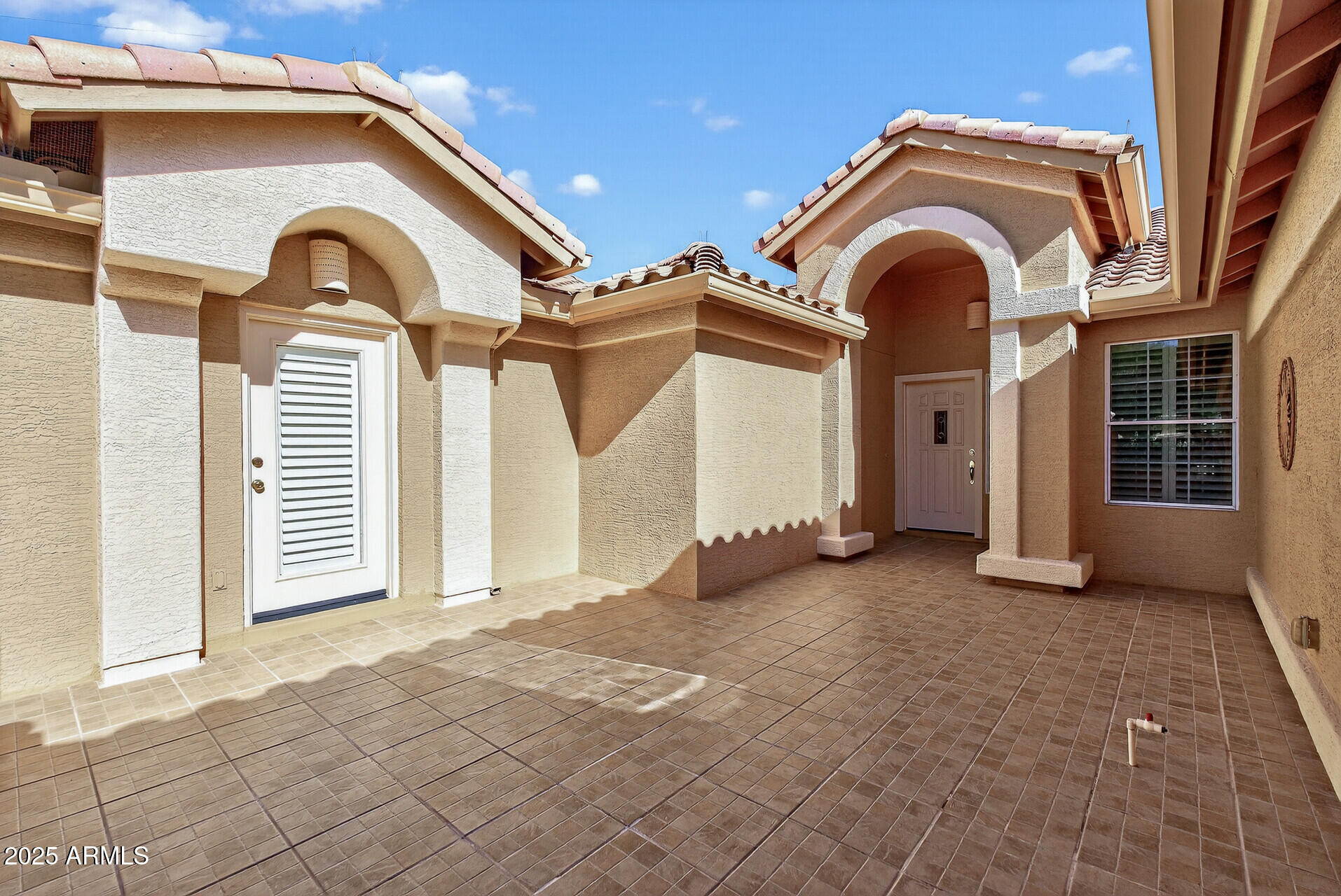 3533 North 159th Lane Goodyear, AZ 85395 - Photo 6 of 65 a view of a house with a pathway