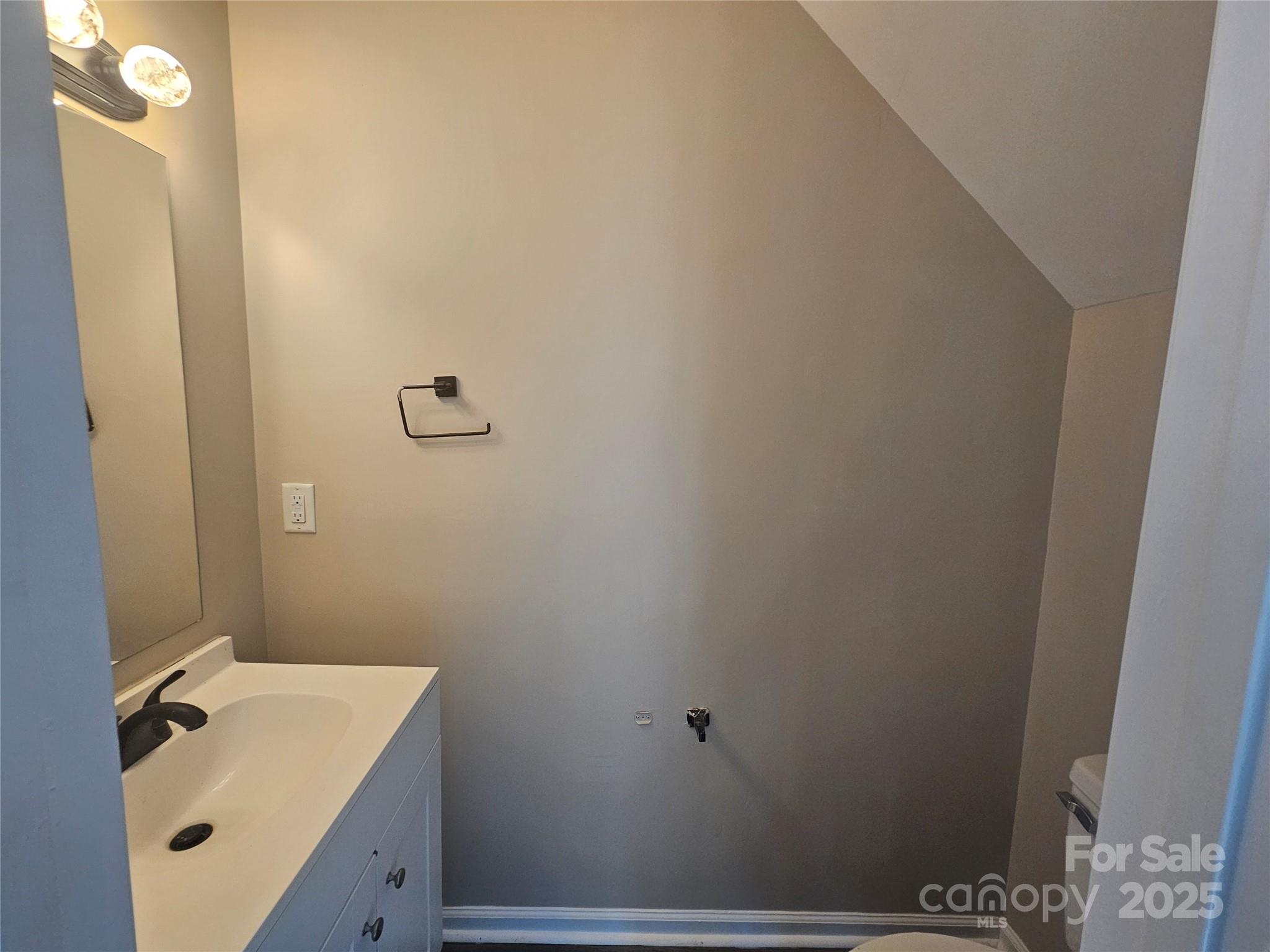 106 Steinkuhler Street, Unit 6 Chester, SC 29706 - Photo 12 of 25 a bathroom with a sink and mirror