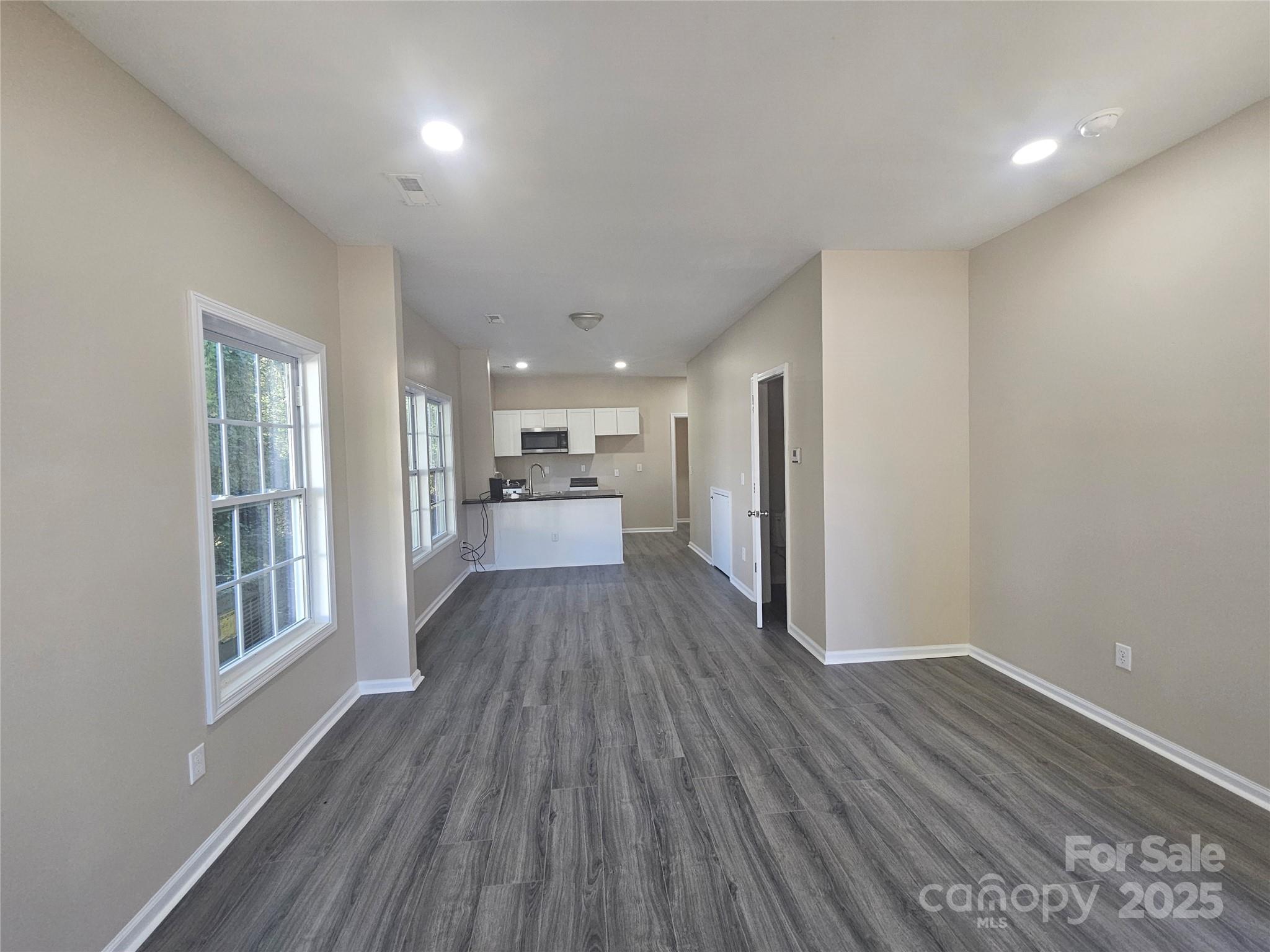 106 Steinkuhler Street, Unit 6 Chester, SC 29706 - Photo 13 of 25 a view of a kitchen with wooden floor and a window