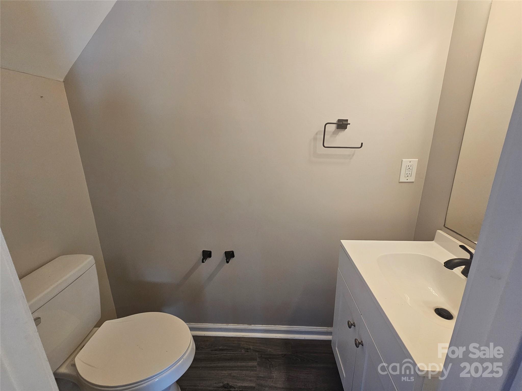 106 Steinkuhler Street, Unit 6 Chester, SC 29706 - Photo 14 of 25 a white toilet sitting next to a small sink