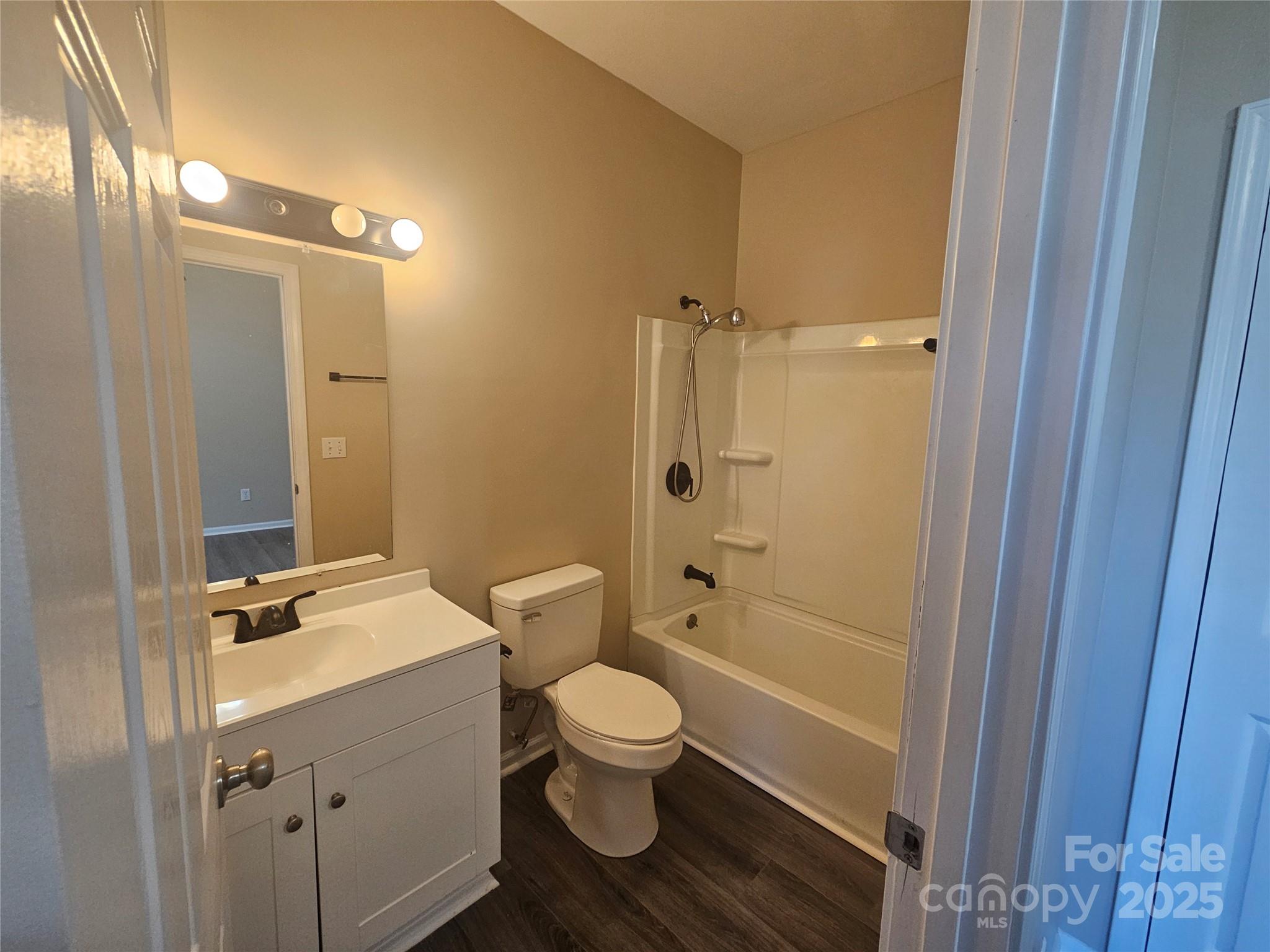 106 Steinkuhler Street, Unit 6 Chester, SC 29706 - Photo 18 of 25 a bathroom with a granite countertop sink toilet and shower