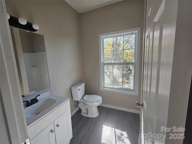 a bathroom with a toilet sink and tub