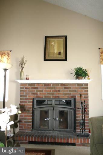 8660 Mission Road Jessup, MD 20794 - Photo 27 of 30 brick fireplace with heatlator