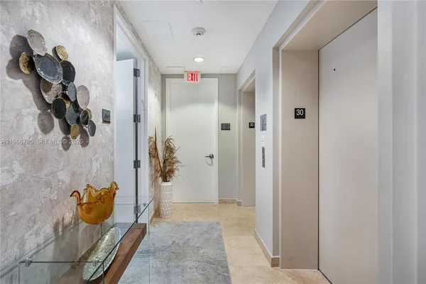 a kitchen with stainless steel appliances granite countertop a sink a stove and a microwave