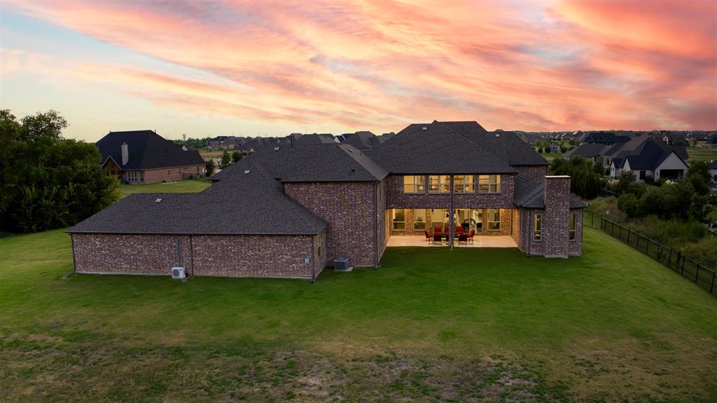 901 Inverness Court Lucas, TX 75002 - Photo 39 of 40 Back of property with a yard, a patio, and brick siding