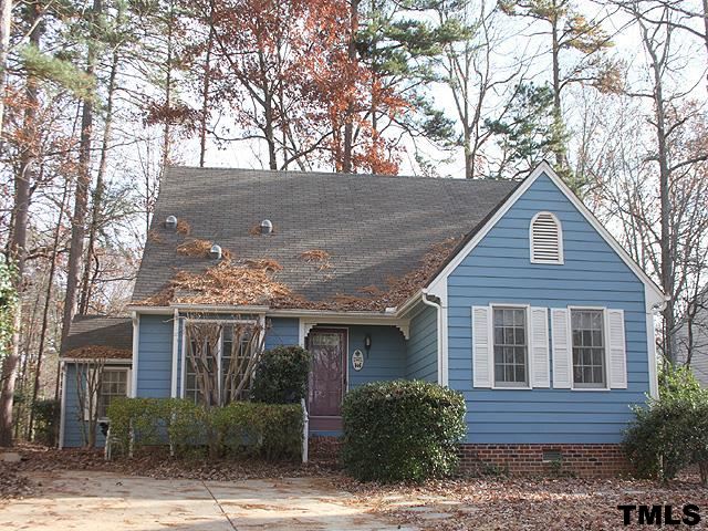 1213 Oakside Court Raleigh, NC 27609 - Photo 1 of 13 a front view of a house with garden and plants