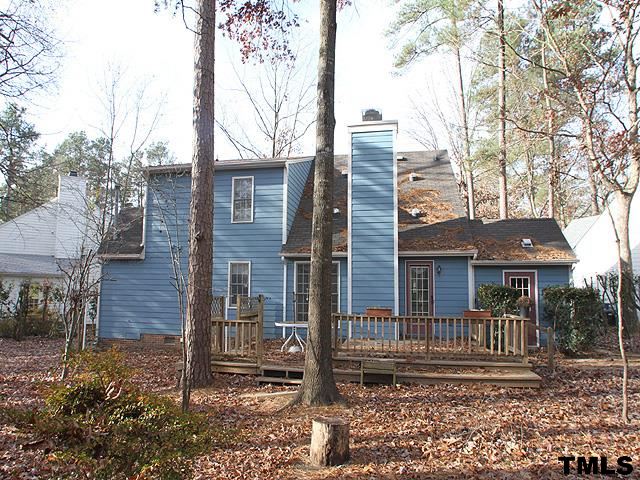 1213 Oakside Court Raleigh, NC 27609 - Photo 13 of 13 a view of a brick house next to a yard