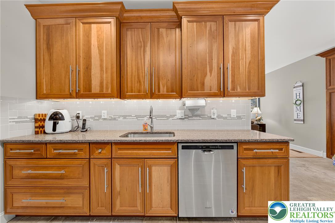 1702 Red Bud Road Quakertown, PA 18951 - Photo 14 of 68 Custom cabinetry and sparkling countertops create an inviting and functional kitchen space.