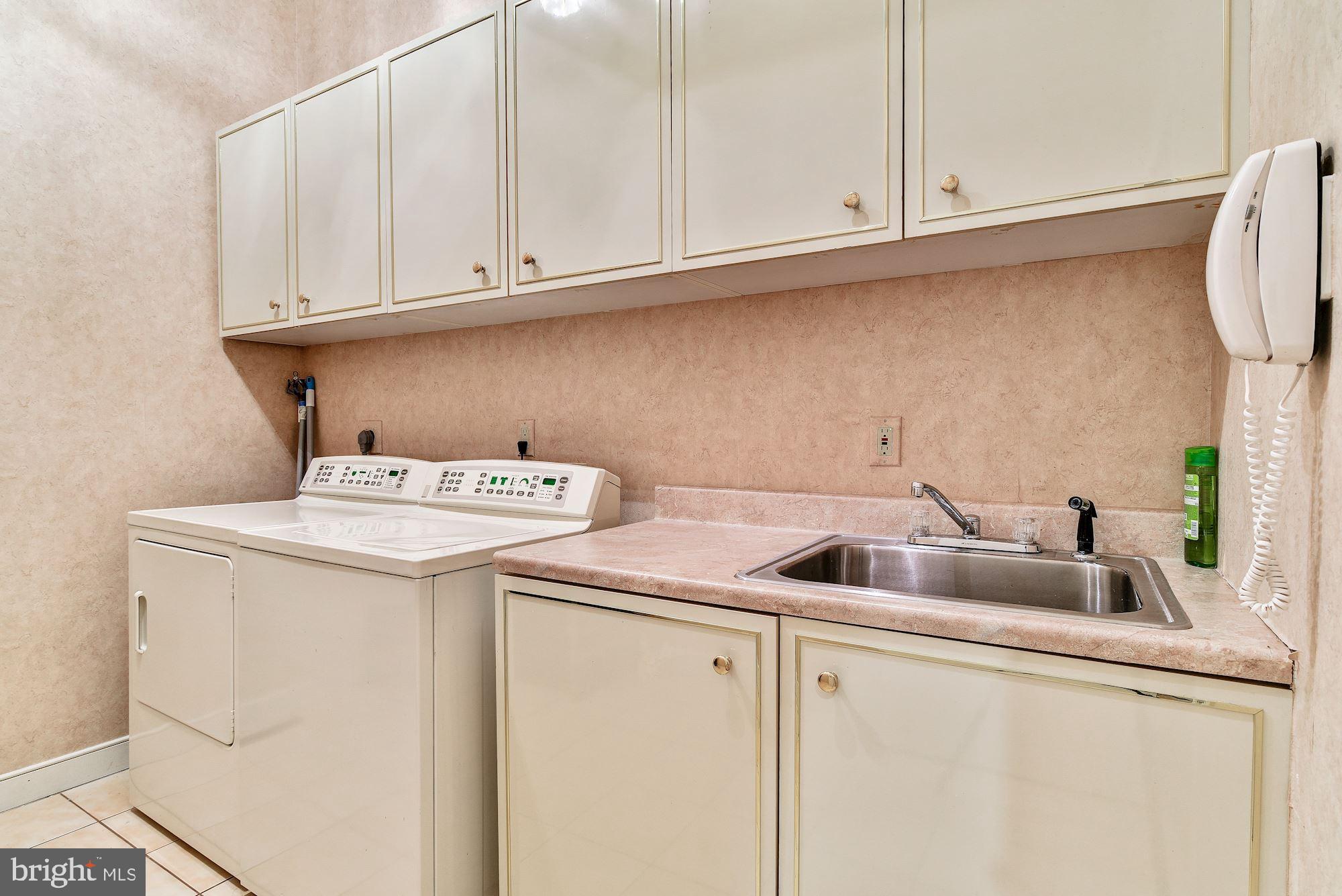 13047 Hall Shop Road Highland, MD 20777 - Photo 41 of 58 Laundry Center, SS Sink and Cabinetry