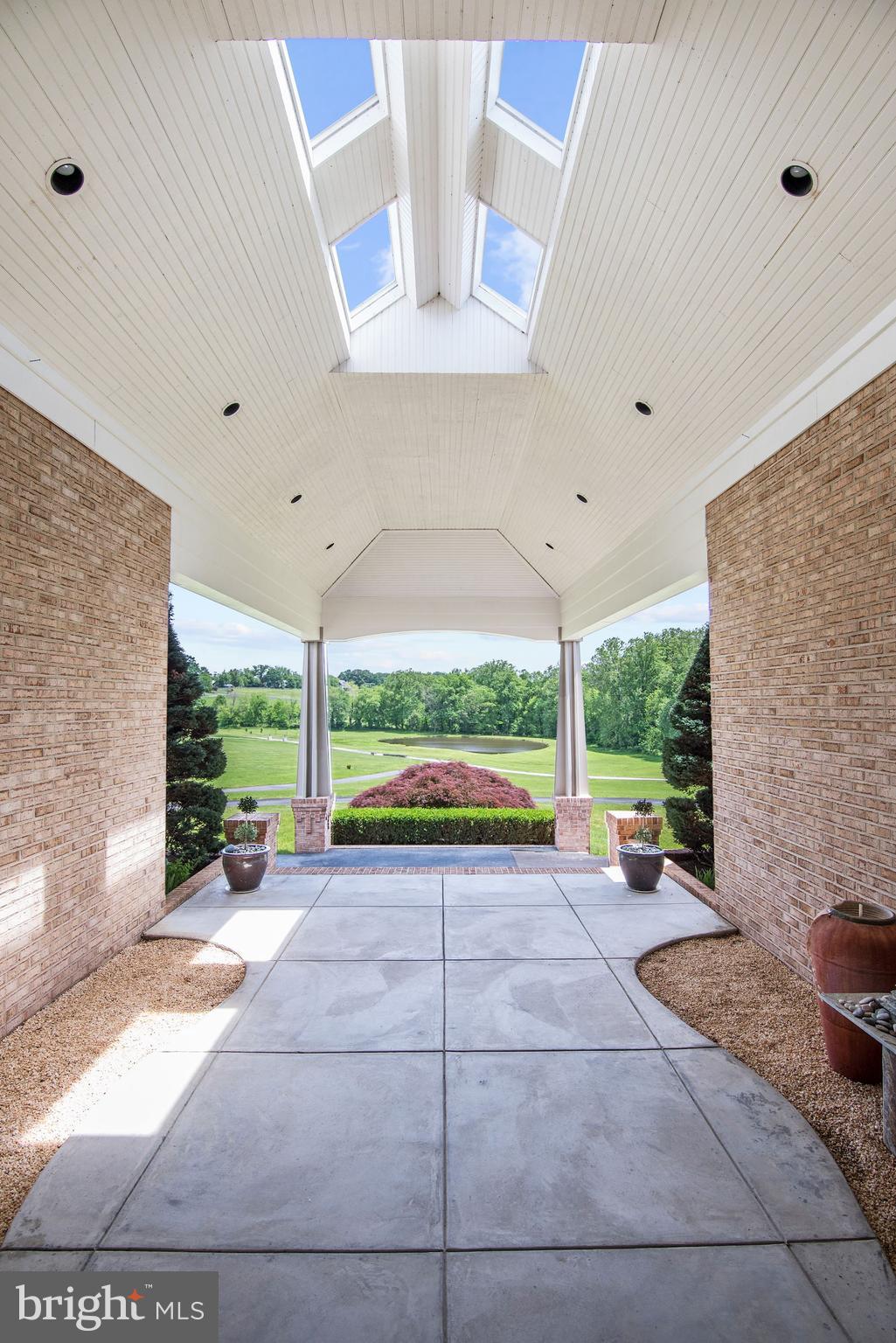13047 Hall Shop Road Highland, MD 20777 - Photo 6 of 58 Covered Entry & Skylights Overlooking Pond