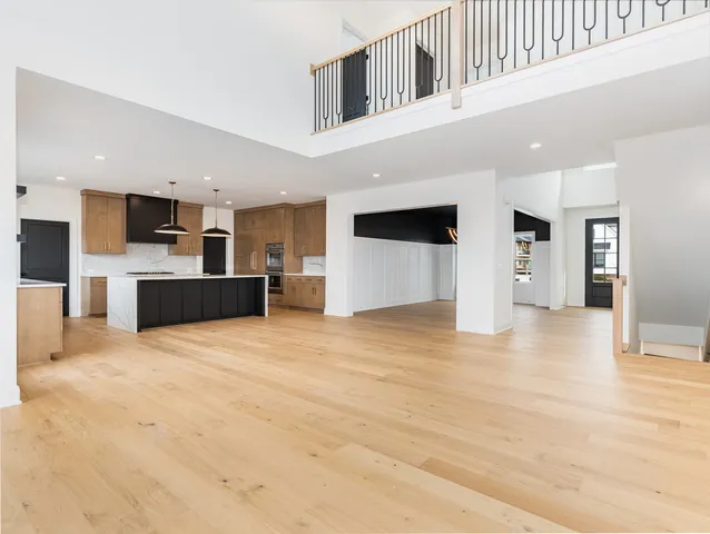 a view of large kitchen with stainless steel appliances kitchen island