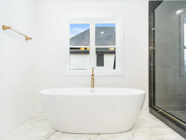 a white bath tub sitting in a bathroom