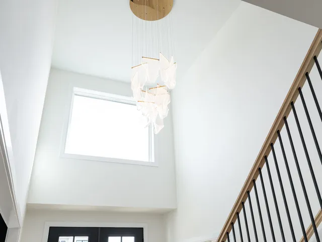 a bathroom with a sink a mirror and a window