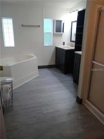 a kitchen with stainless steel appliances a refrigerator and a sink