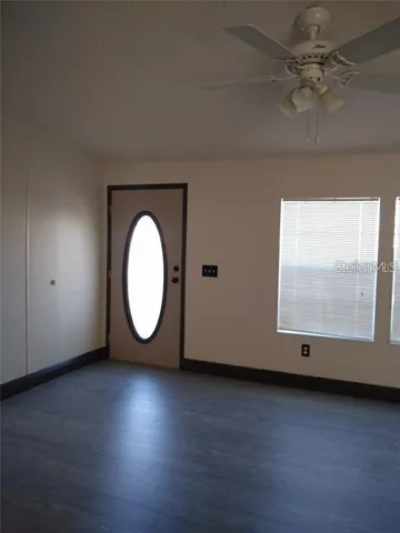 a view of room window and wooden floor