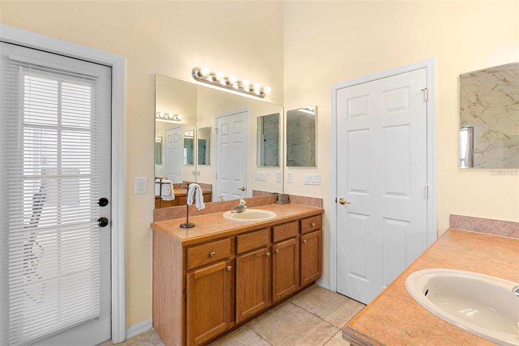 2535 Oneida Loop Kissimmee, FL 34747 - Photo 39 of 59 Primary Bath with Pool access