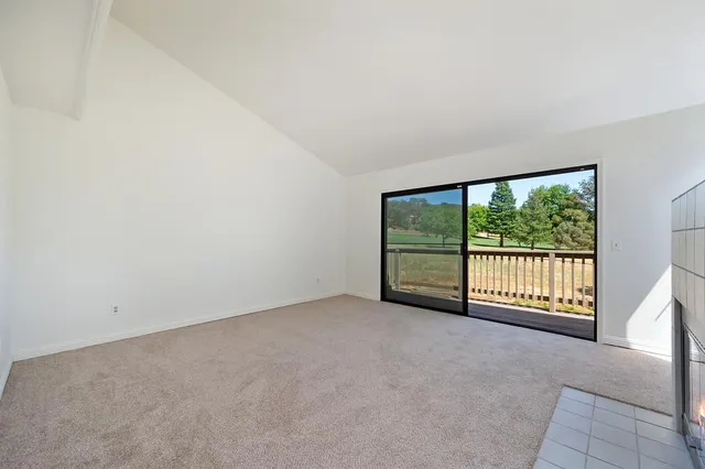 an empty room with large windows