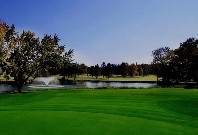 a view of a lake with houses in the back