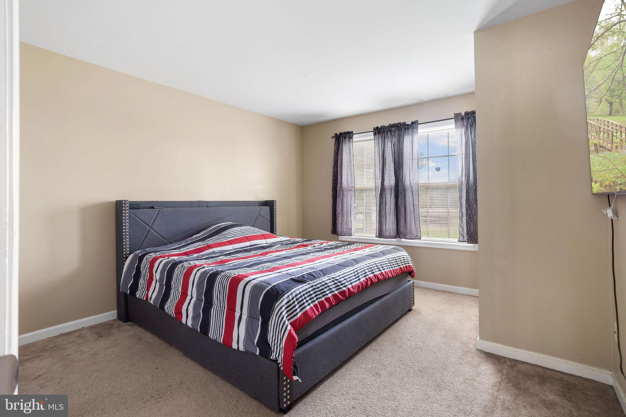 954 East Walnut Road Vineland, NJ 08360 - Photo 13 of 25 a bed sitting in a bedroom next to a window