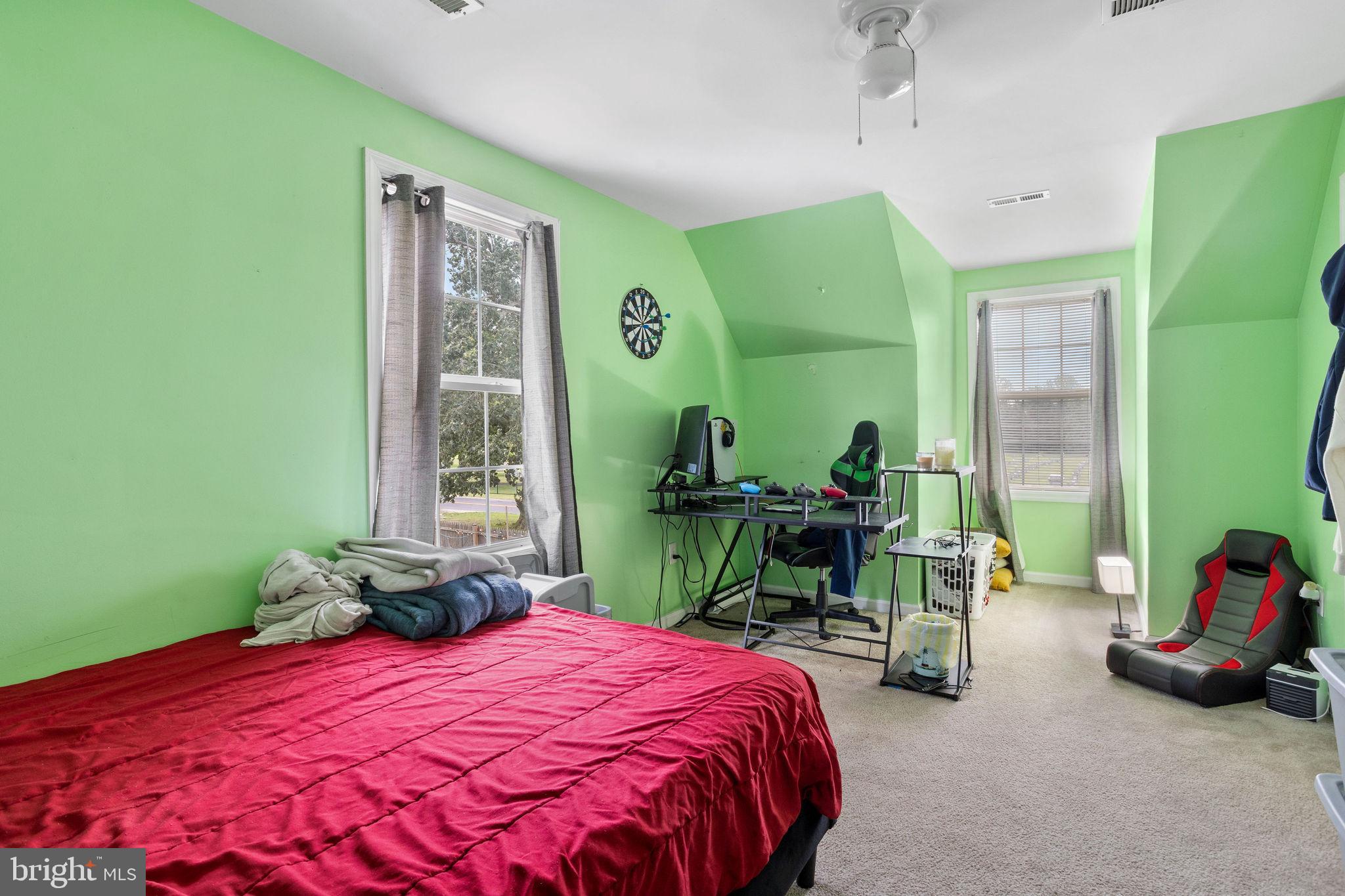 954 East Walnut Road Vineland, NJ 08360 - Photo 19 of 25 a bedroom with a bed a table and chair