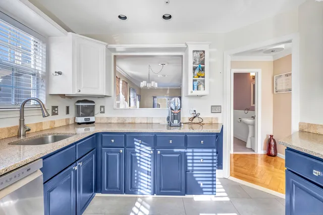 a kitchen with a sink and cabinets
