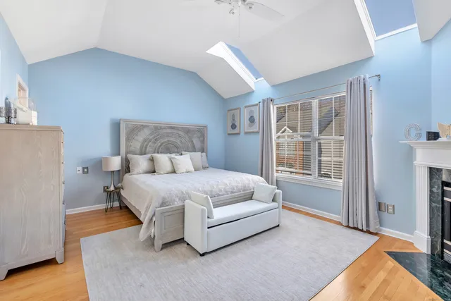 a spacious bedroom with a bed and a window