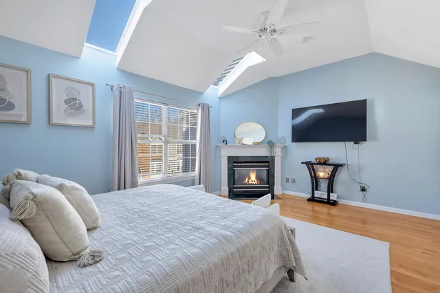 a bedroom with a bed and a television