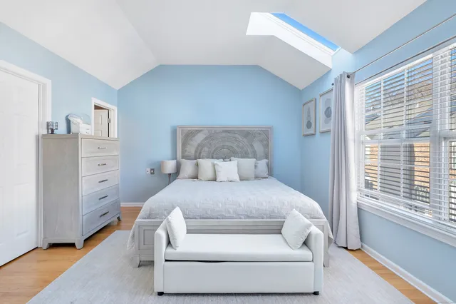 a bed room with a bed and a window