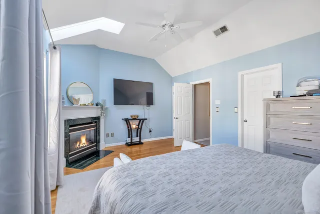 a bedroom with a bed and a television