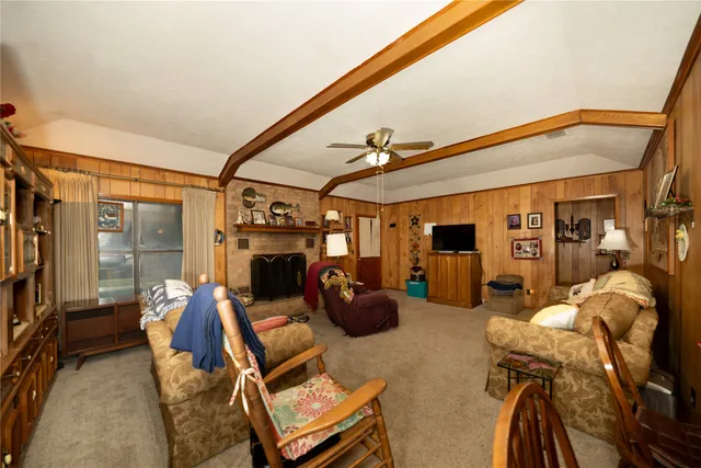 a kitchen with stainless steel appliances kitchen island granite countertop a refrigerator stove top oven a sink and dishwasher