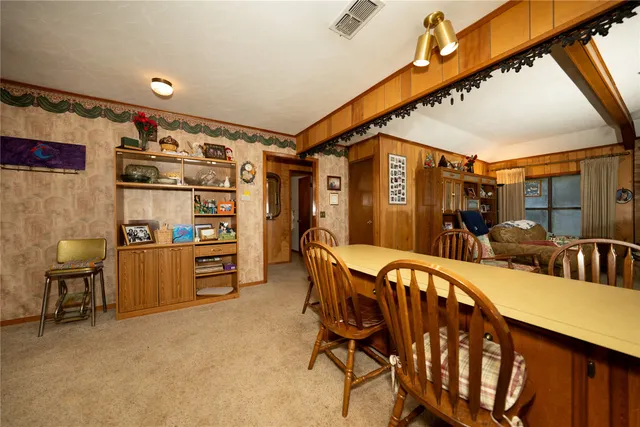a kitchen with cabinets and wooden floor