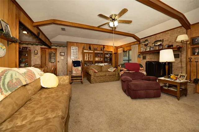 a spacious bathroom with a granite countertop sink a toilet and mirror