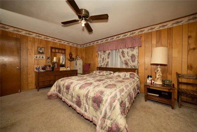 a kitchen with stainless steel appliances granite countertop a sink and a refrigerator