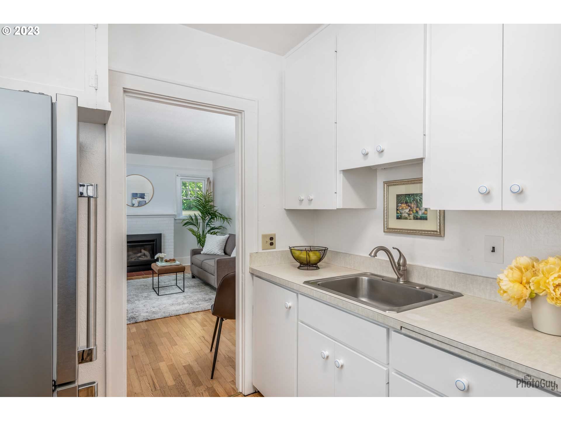 1041 Madison Street Eugene, OR 97402 - Photo 12 of 34 a kitchen with sink cabinets and counter space