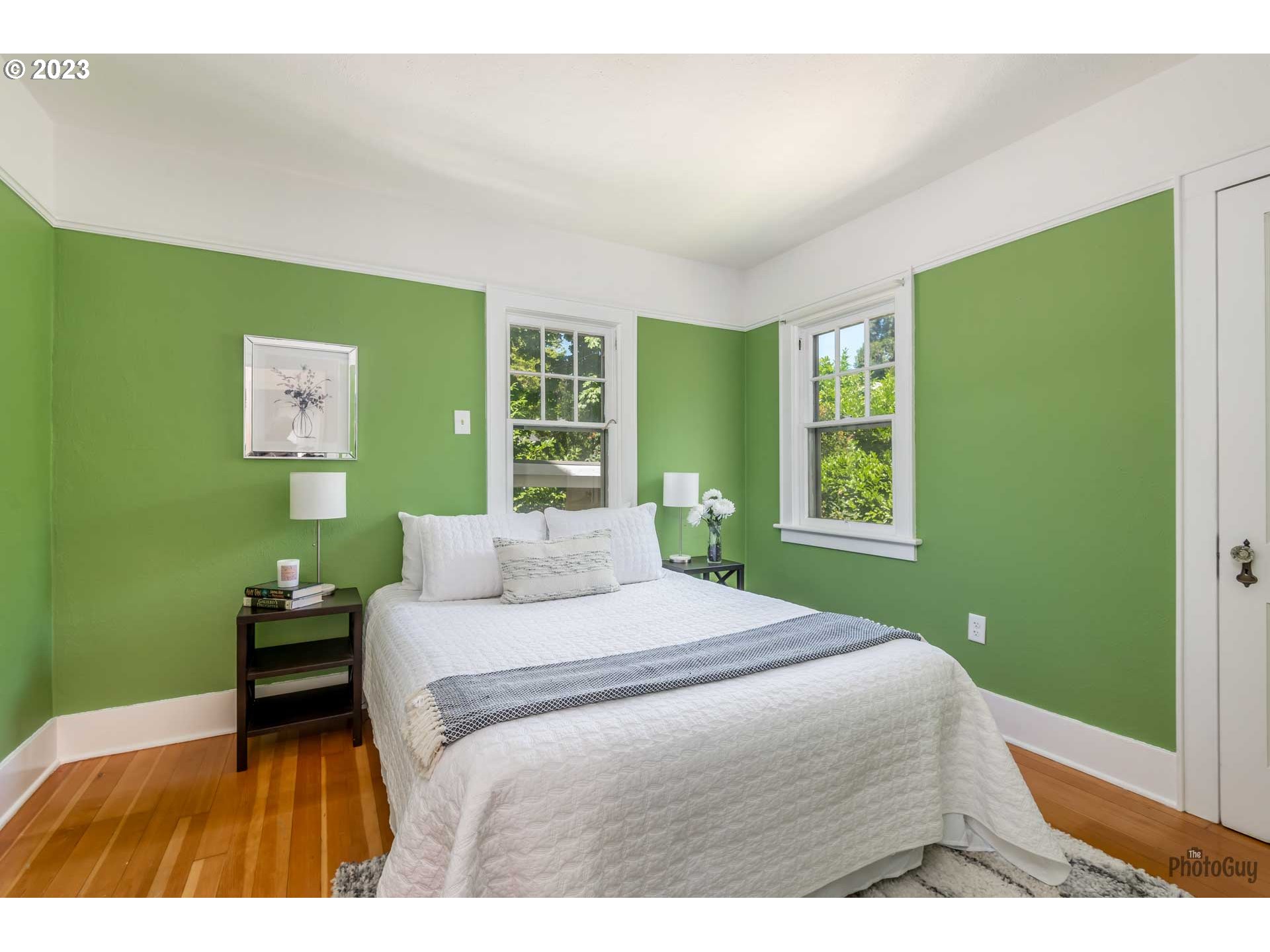 1041 Madison Street Eugene, OR 97402 - Photo 15 of 34 a bedroom with a bed and windows